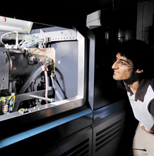 Student watches mass spectrometer
